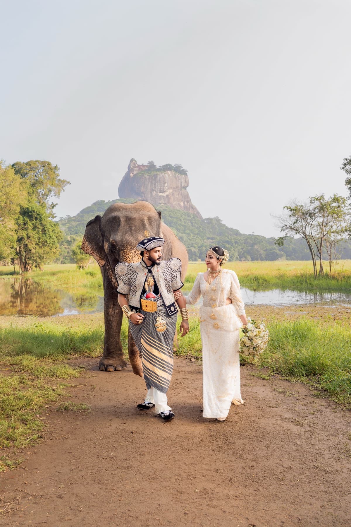 Couple at Sigiriya with elephant, Sri Lanka
